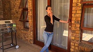 MILF brunette gets herself soaked outdoors smoking