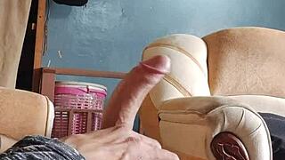 A solo performance of a Latino man pleasuring himself in the living room for women